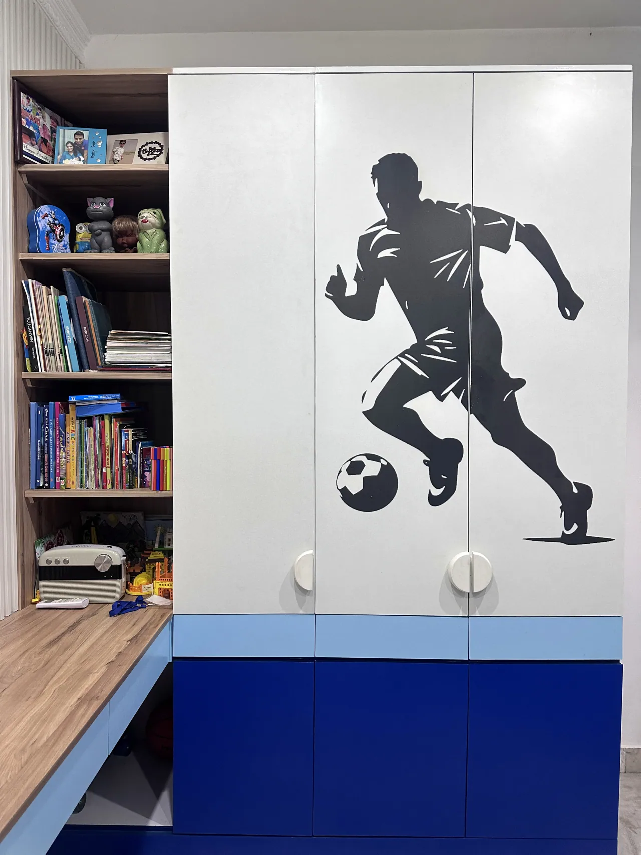 Close view of footballer graphic and coordinated wardrobe storage