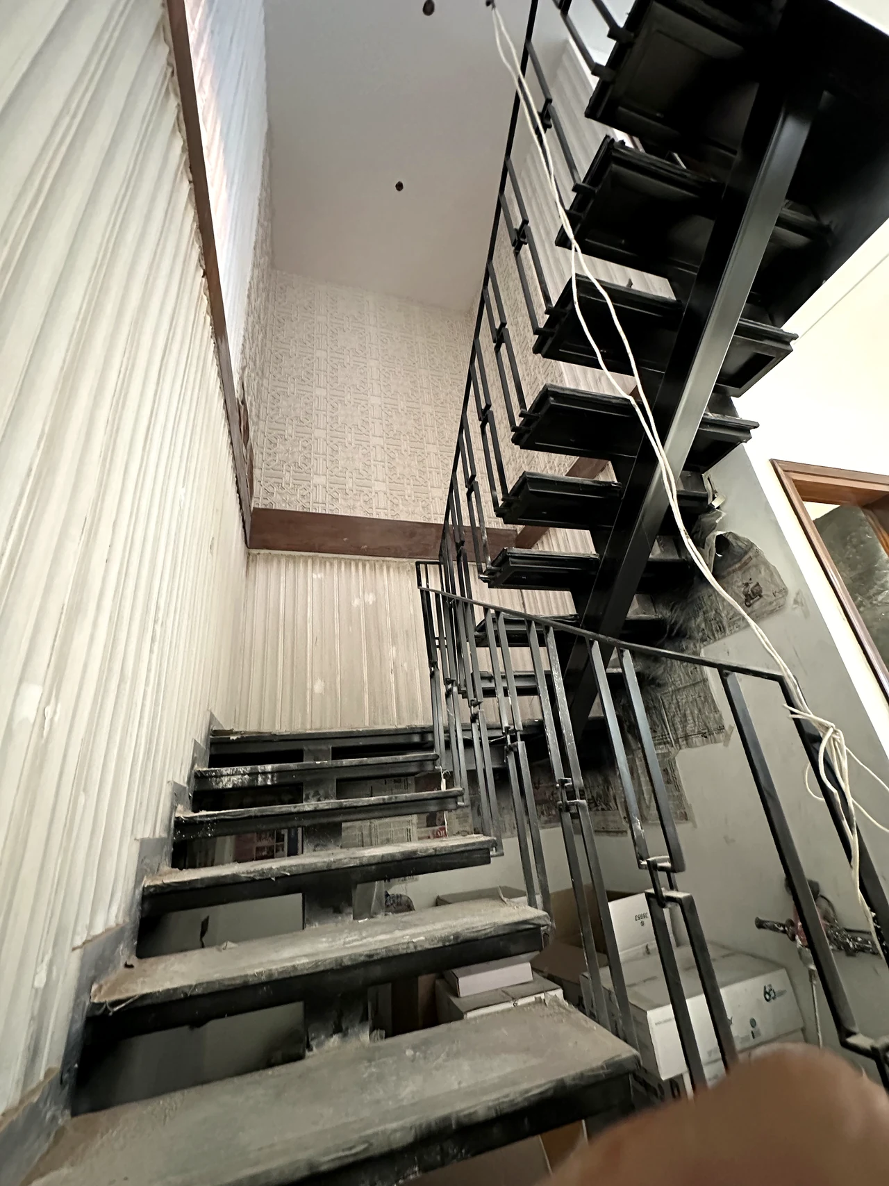 Close view of the staircase structure and upper landing during site work