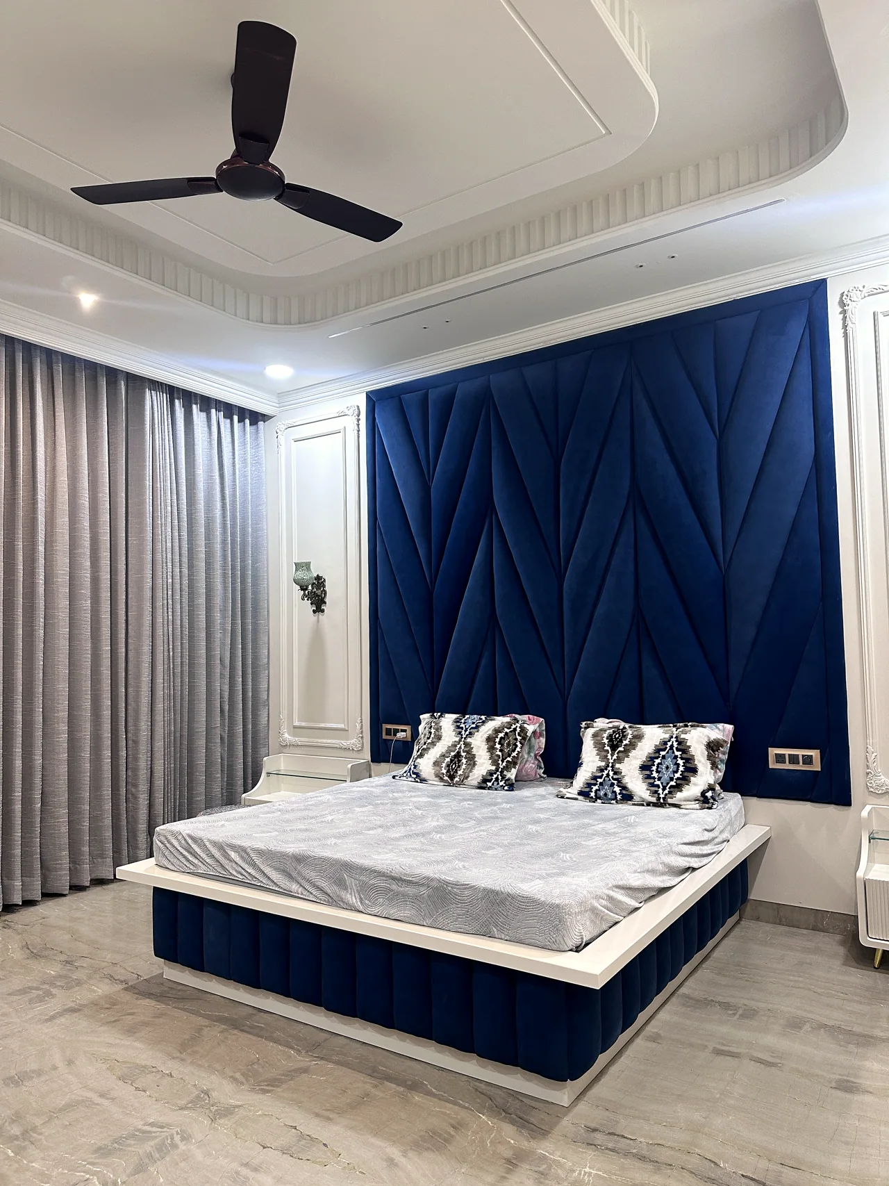 Alternate perspective of the blue bedroom and bedside details
