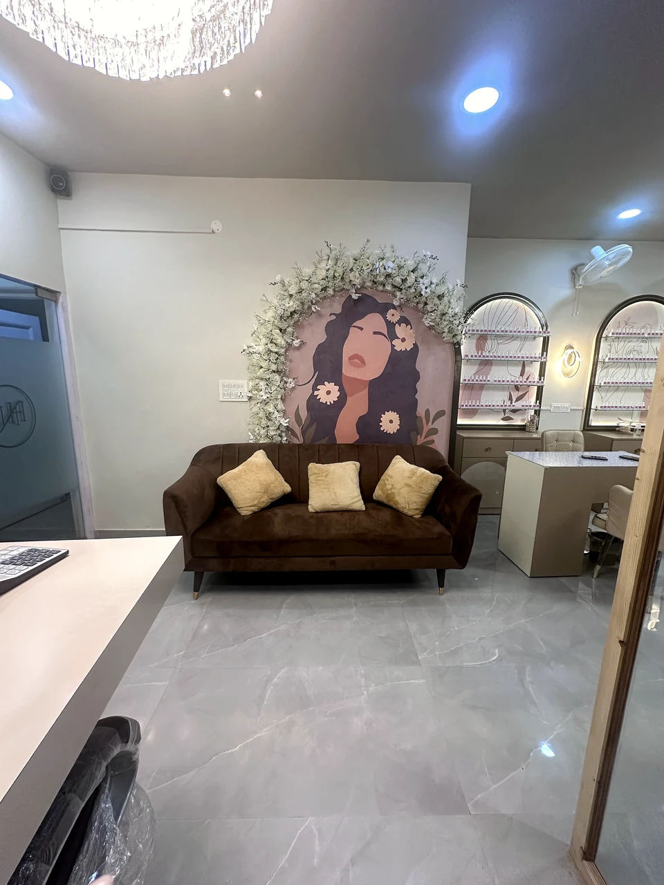 Guest lounge and floral feature mural inside the Phase 3B2 nail salon