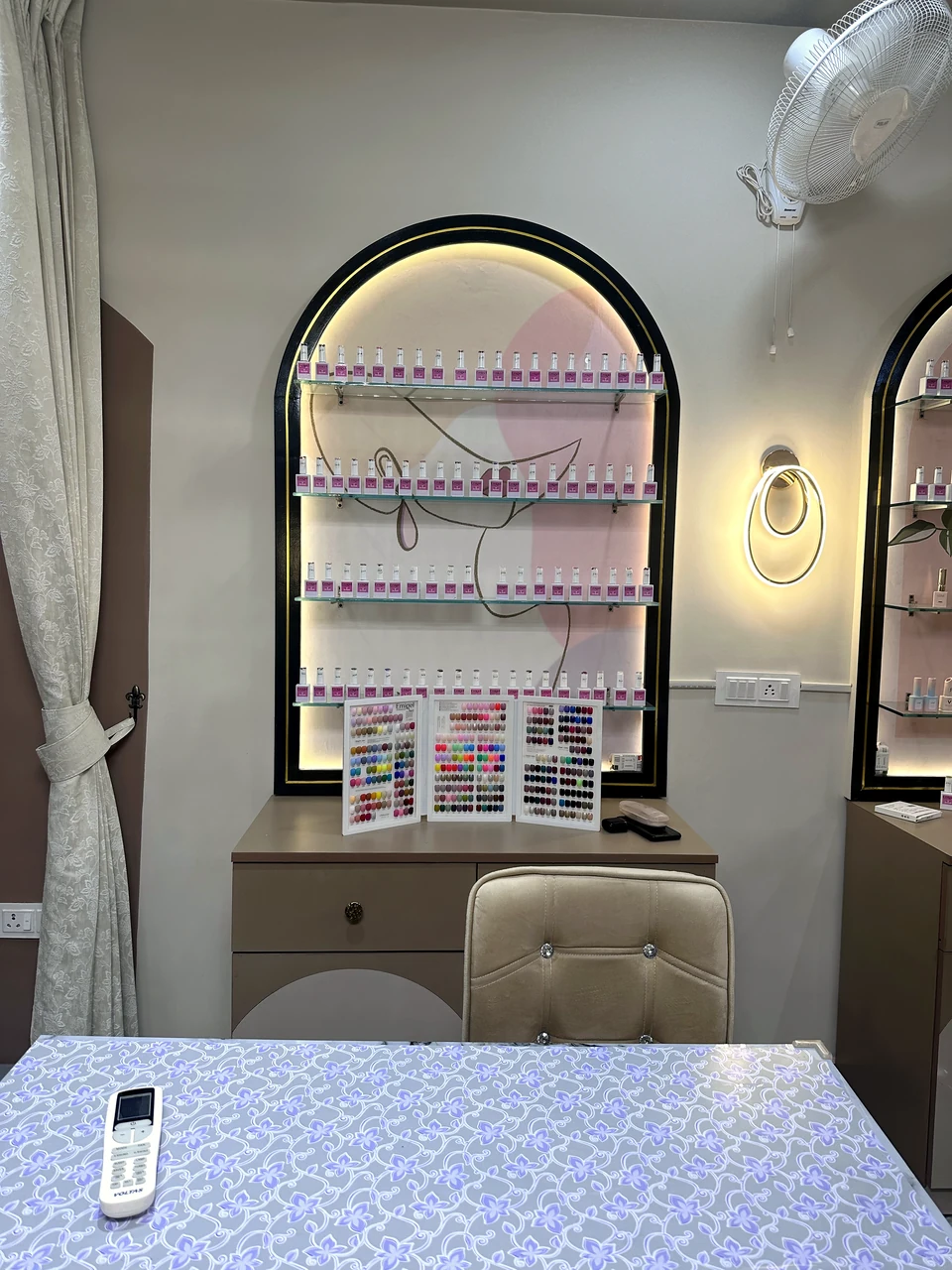 Nail polish display and consultation table in Sheena Nail Studio