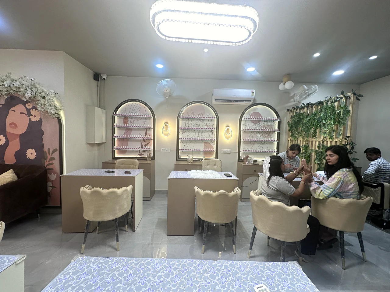 Nail treatment stations, guest seating and illuminated polish displays