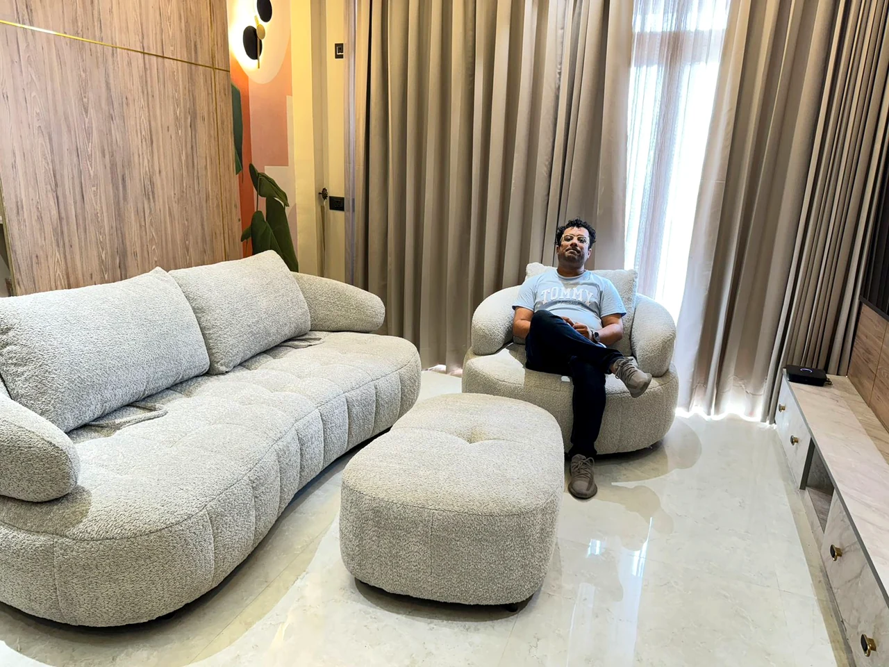 Curved sofa arrangement with a compact round coffee table