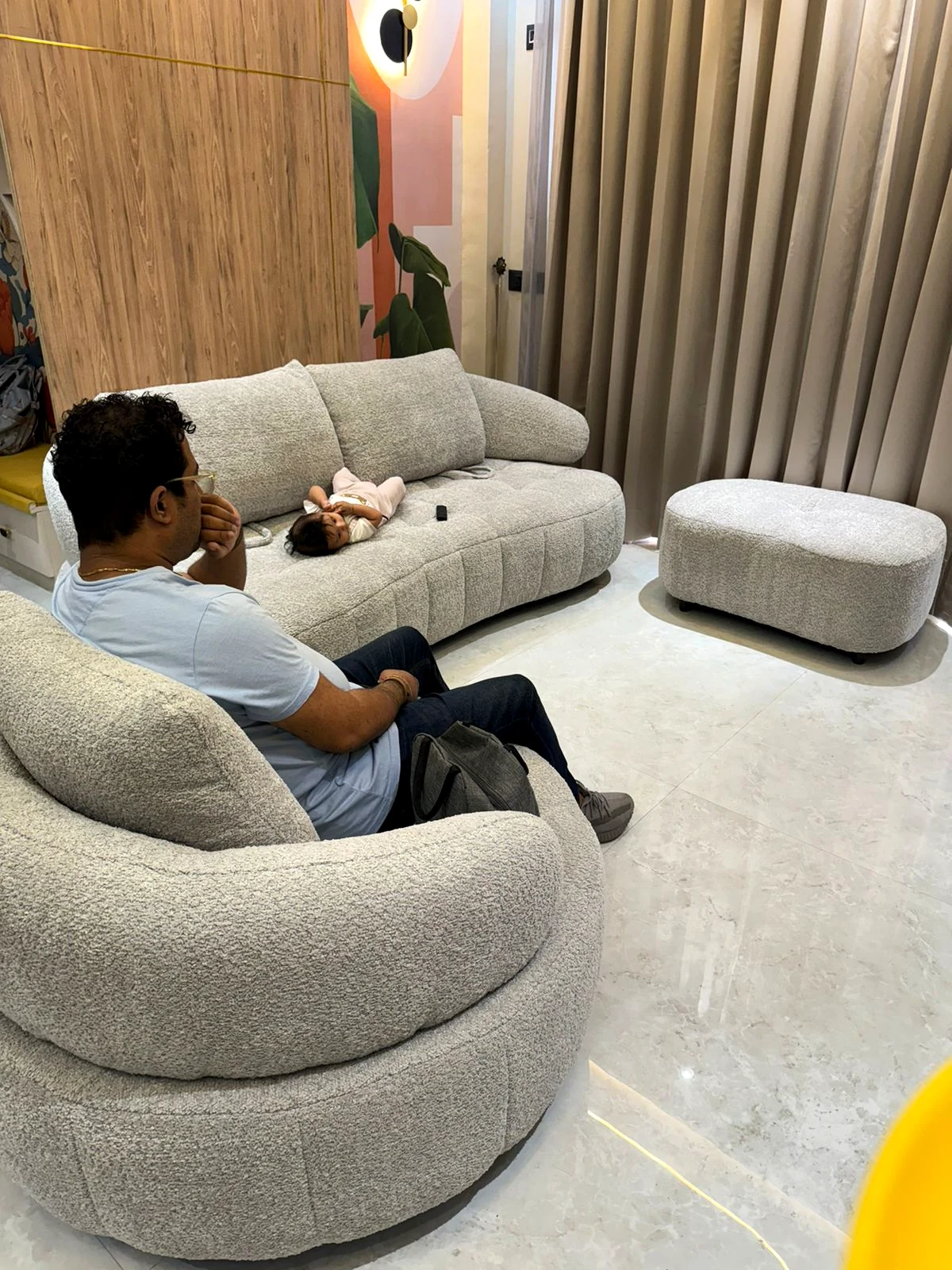 Curved lounge seating viewed from the side of the living room